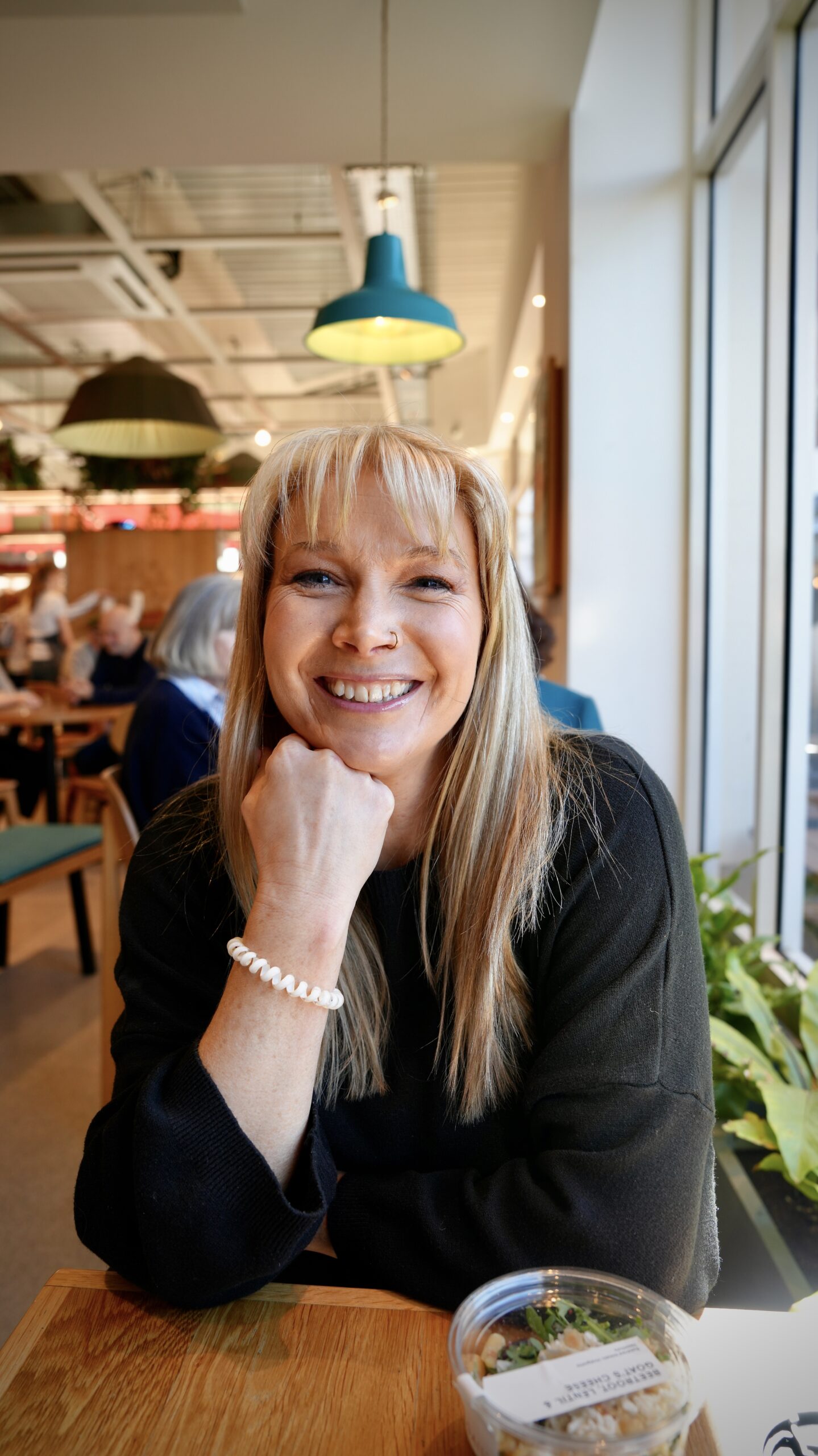 Becky Stone – Trauma-Informed Therapist in Canterbury Becky Stone seated and smiling in a grey top – a warm, trauma-informed counsellor supporting people with depression, eating disorders, and emotional healing.