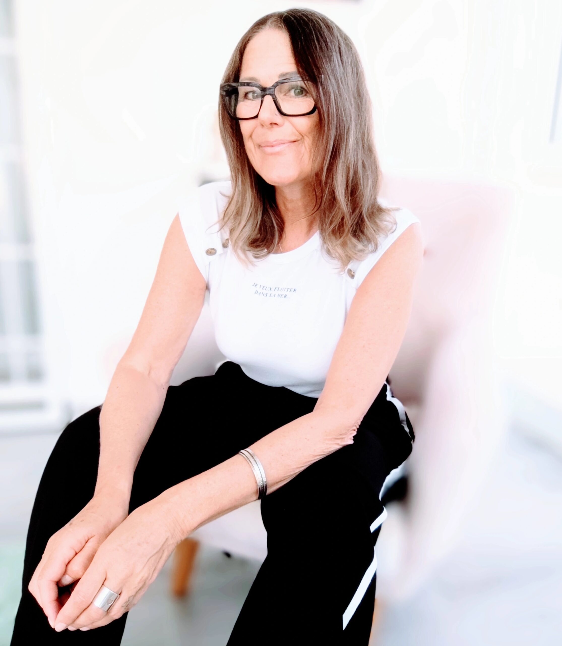 Therapist working on website visibility for AI search Mel Lay, private practice marketing coach, reviewing therapist website content to improve visibility in AI search tools and Google