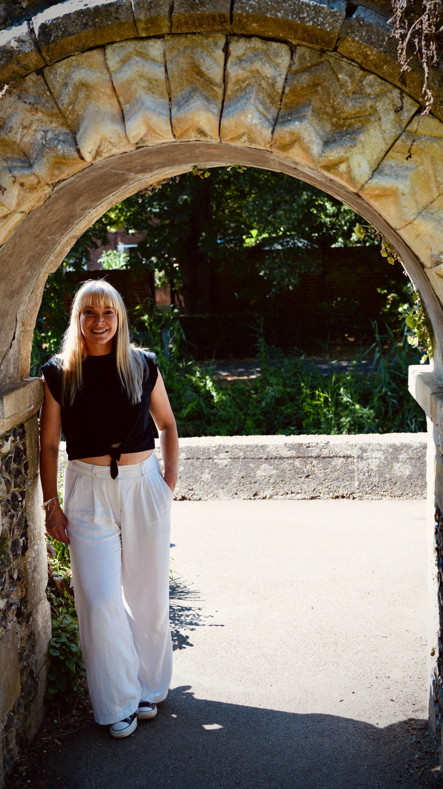 Becky Stone, eating disorder therapist in Canterbury, smiling outdoors during a therapy brand photoshoot.