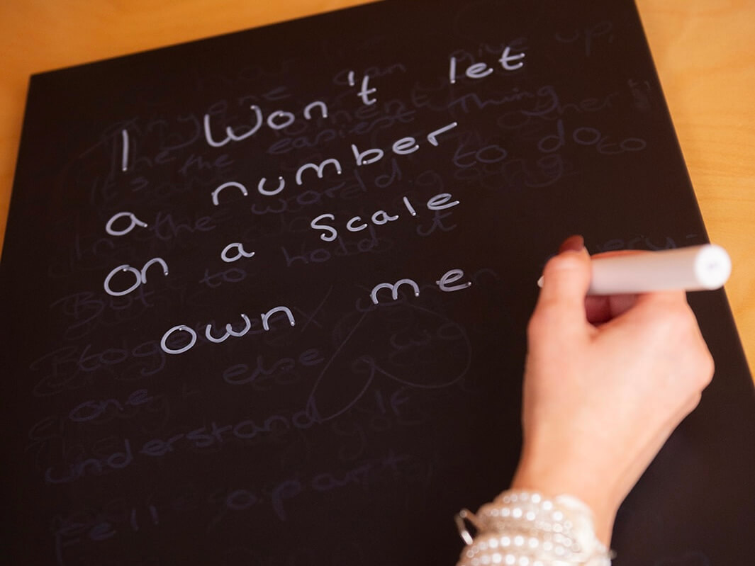 Person reflecting on their relationship with food and body image
