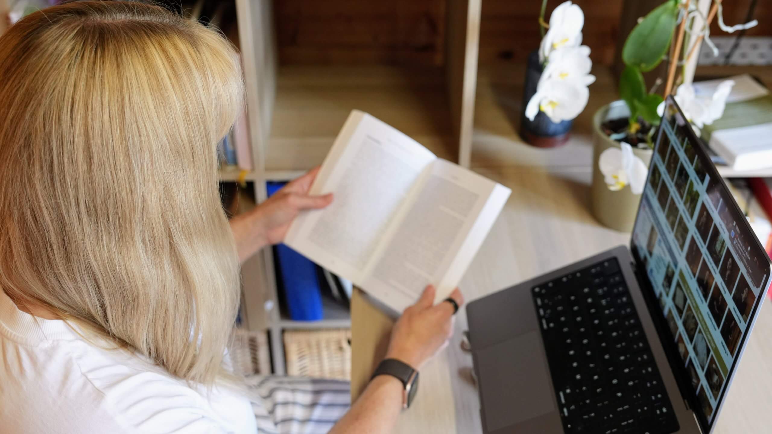 Rebecca Stone reviewing professional resources for ADHD coaching in her Canterbury office.